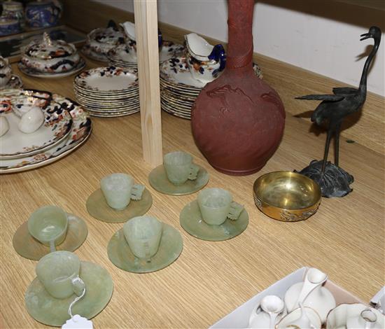 An Oriental pottery bottle vase, a bronze crane, a bowl and 6 hardstone cups and saucers